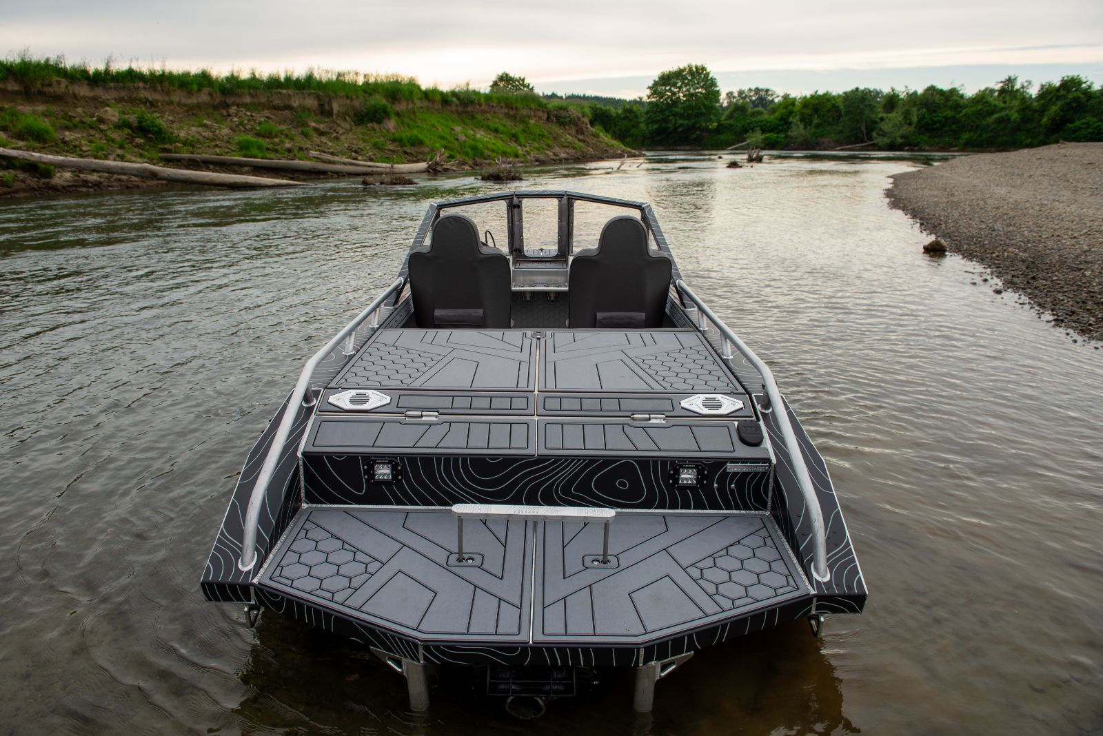 Head-on bow view of a Vaughn Bay Customs jet boat at dusk