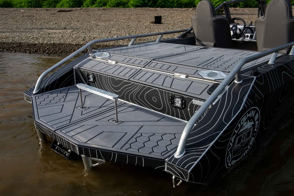 Rear deck of the VB12 show boat with storage boxes, step and non-skid flooring