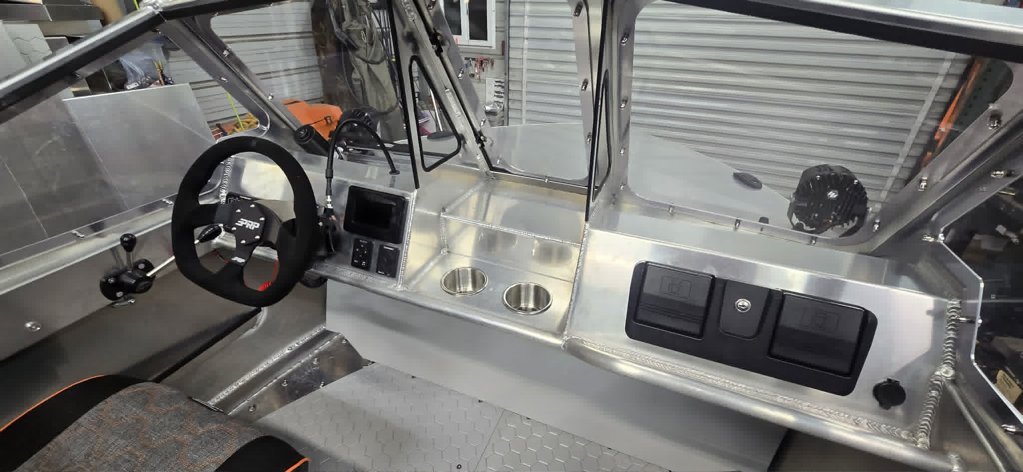 VB14 helm with PRP suede steering wheel, digital display, cup holders and switch panel
