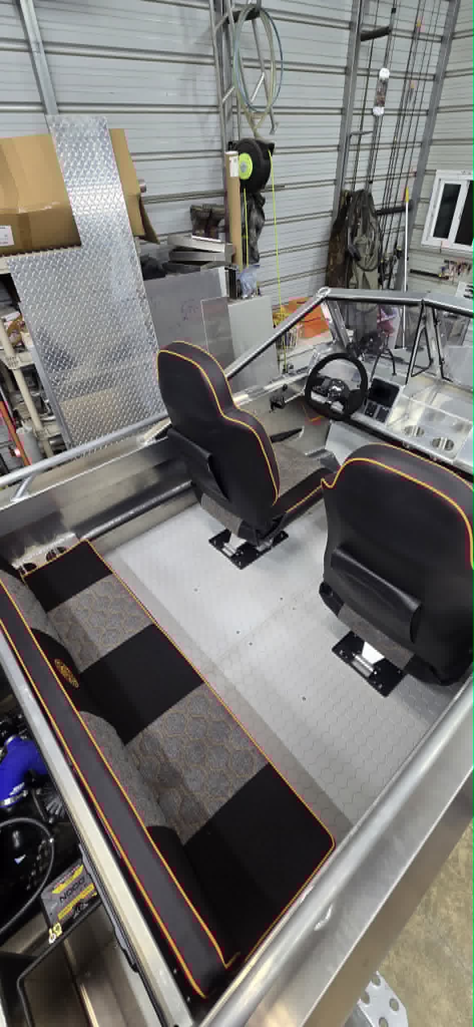 Top-down view of the VB14 interior with PRP suspension seats and gold-piped upholstery