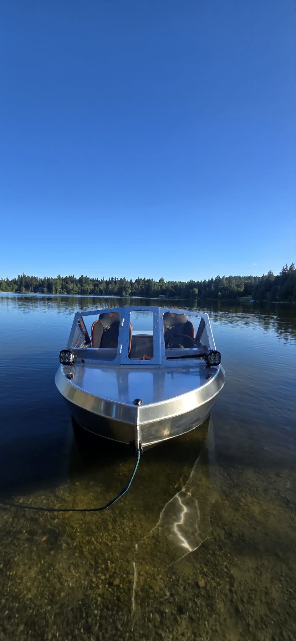Head-on bow of the VB14 showing its faceted welded aluminum entry and Baja Designs pods